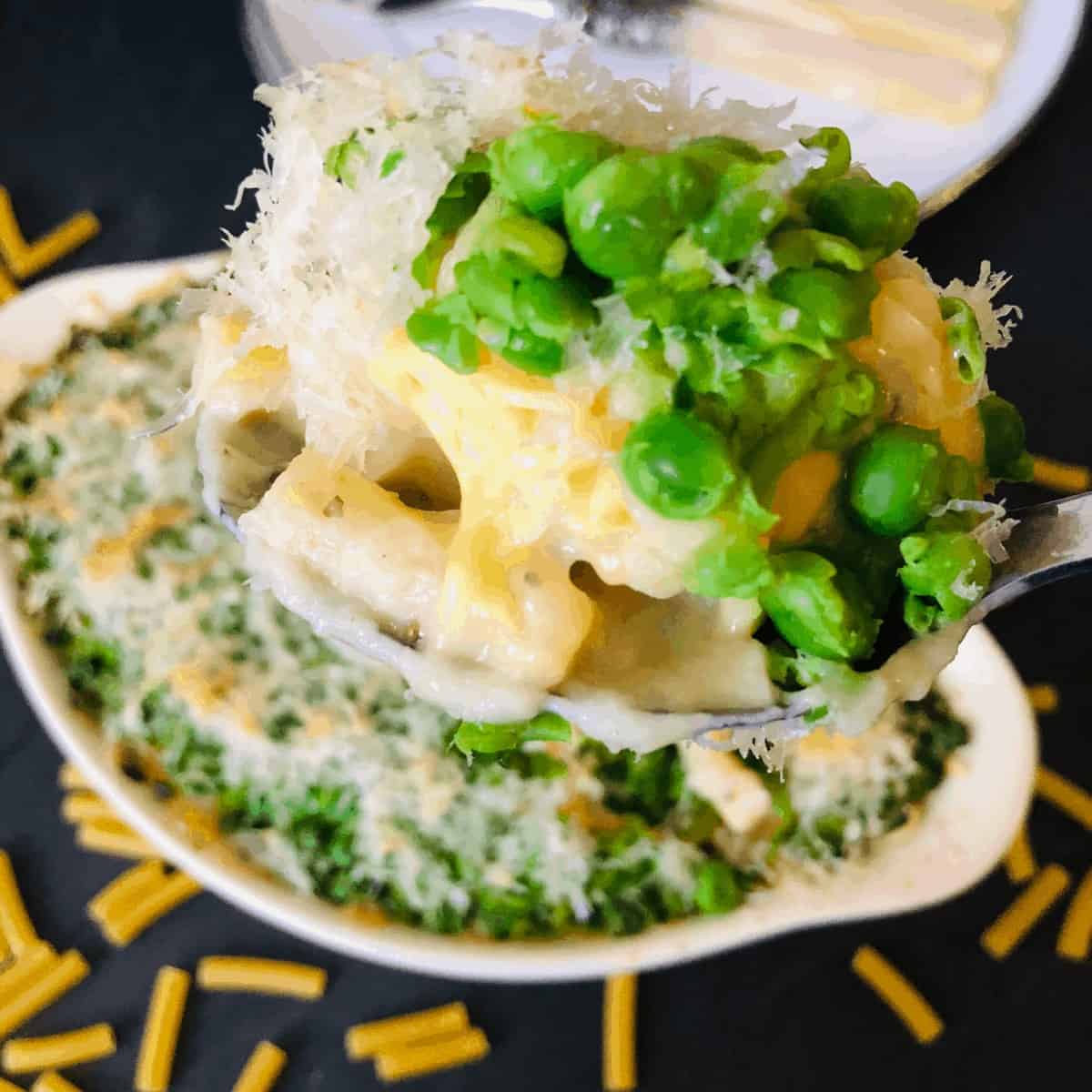 vegan mac and cheese with a pea crust on a spoon