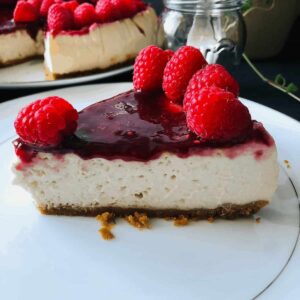 One slice of vegan baked cheesecake on a plate