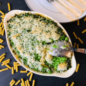 A dish containing vegan mac and cheese with a pea crust