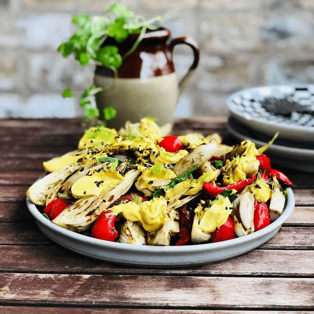 A Plate of Fennel salad with red peppers.