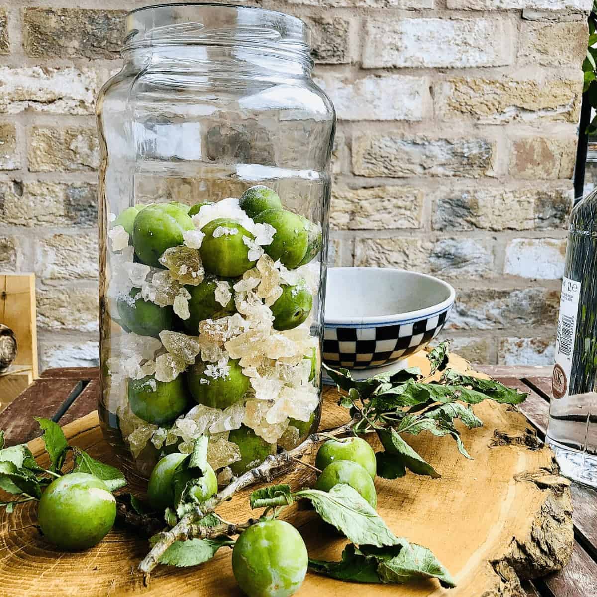 Greengages in a large jar with rock sugar