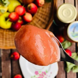 A teaspoon containing crab apple butter