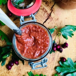 A jar of homemade ketchup made with hawthorn berries.