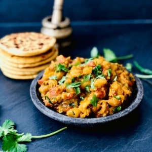 A plate of marrow guhtva garnished with coriander. 