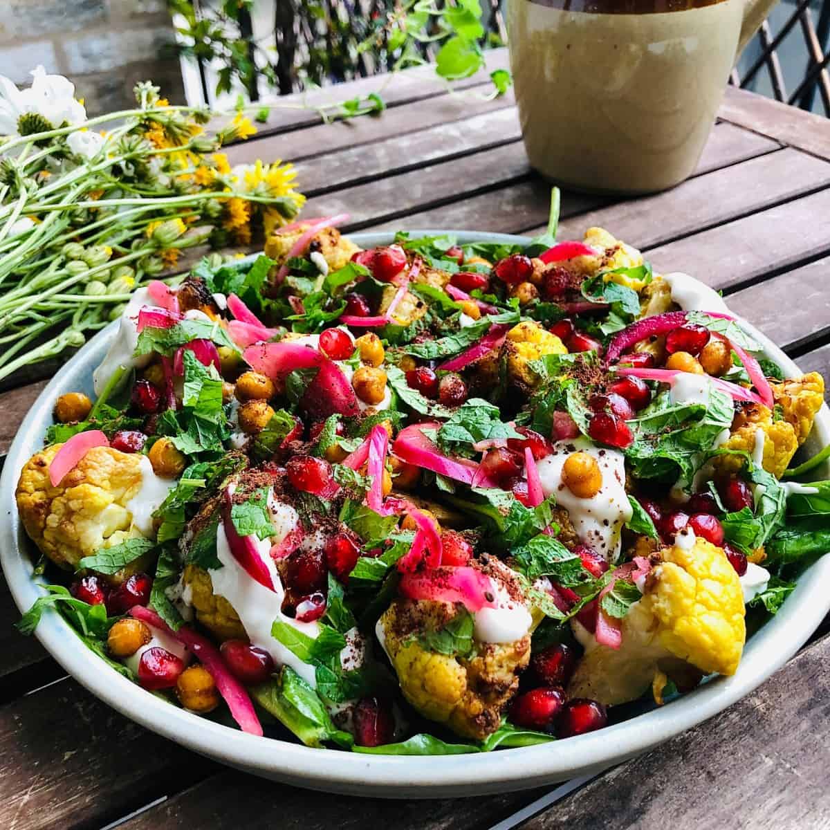 A Plate of roasted cauliflower salad, tandoori style.