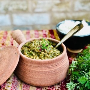 A clay pot containing saag daal