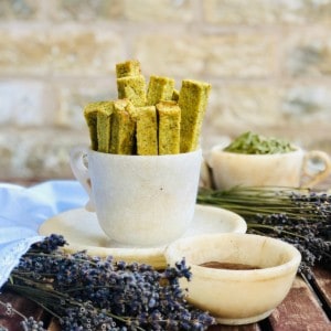 A stoneware cup containing polenta chips