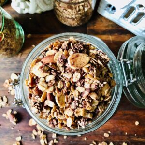 A jar containing chocolate and tahini granola.