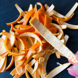 A pile of orange peel cut into strips ready for candying.