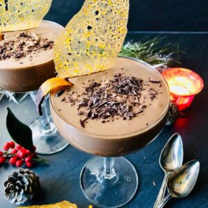 Vegan chocolate mousse in two champagne glasses.