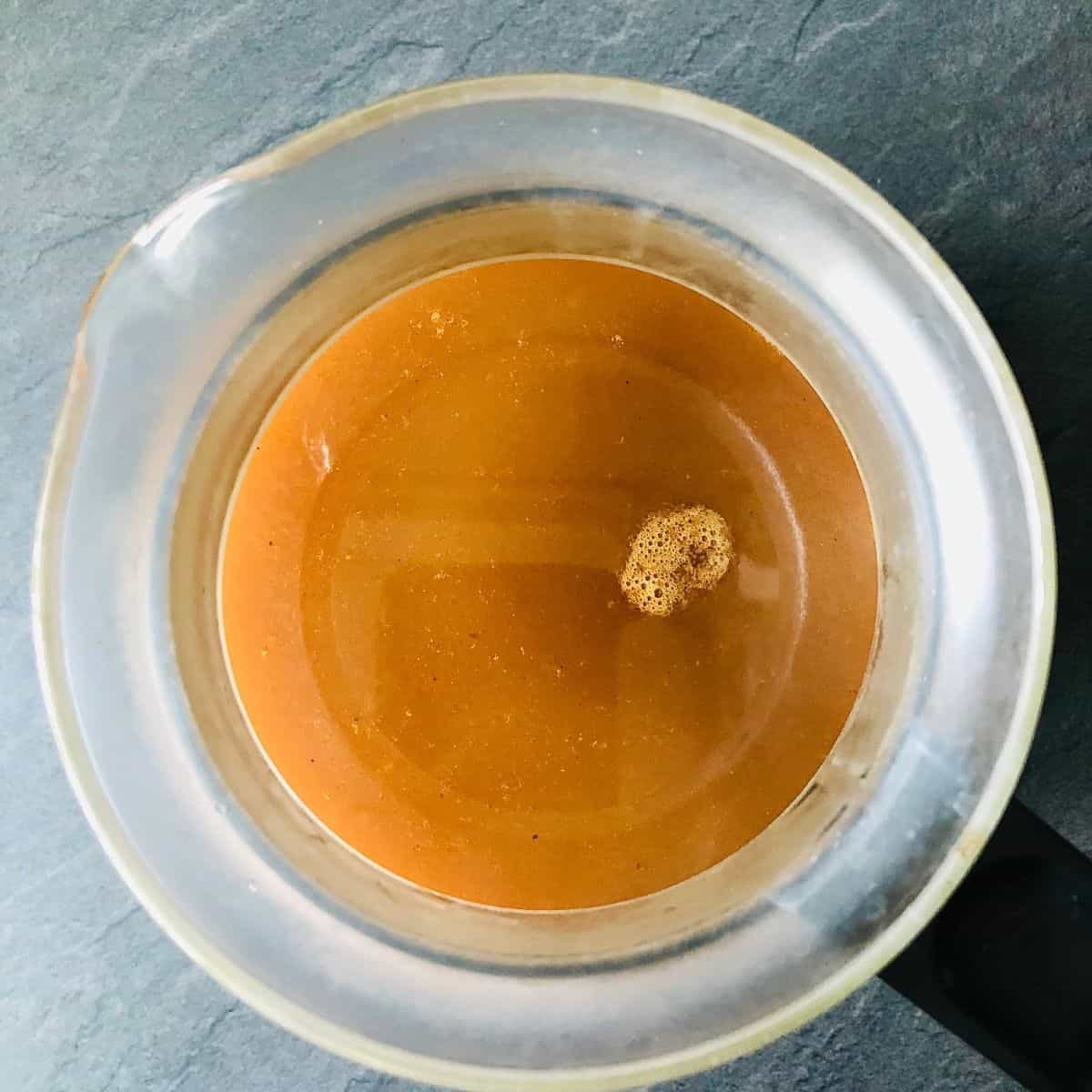 Vegetable stock in a glass jug