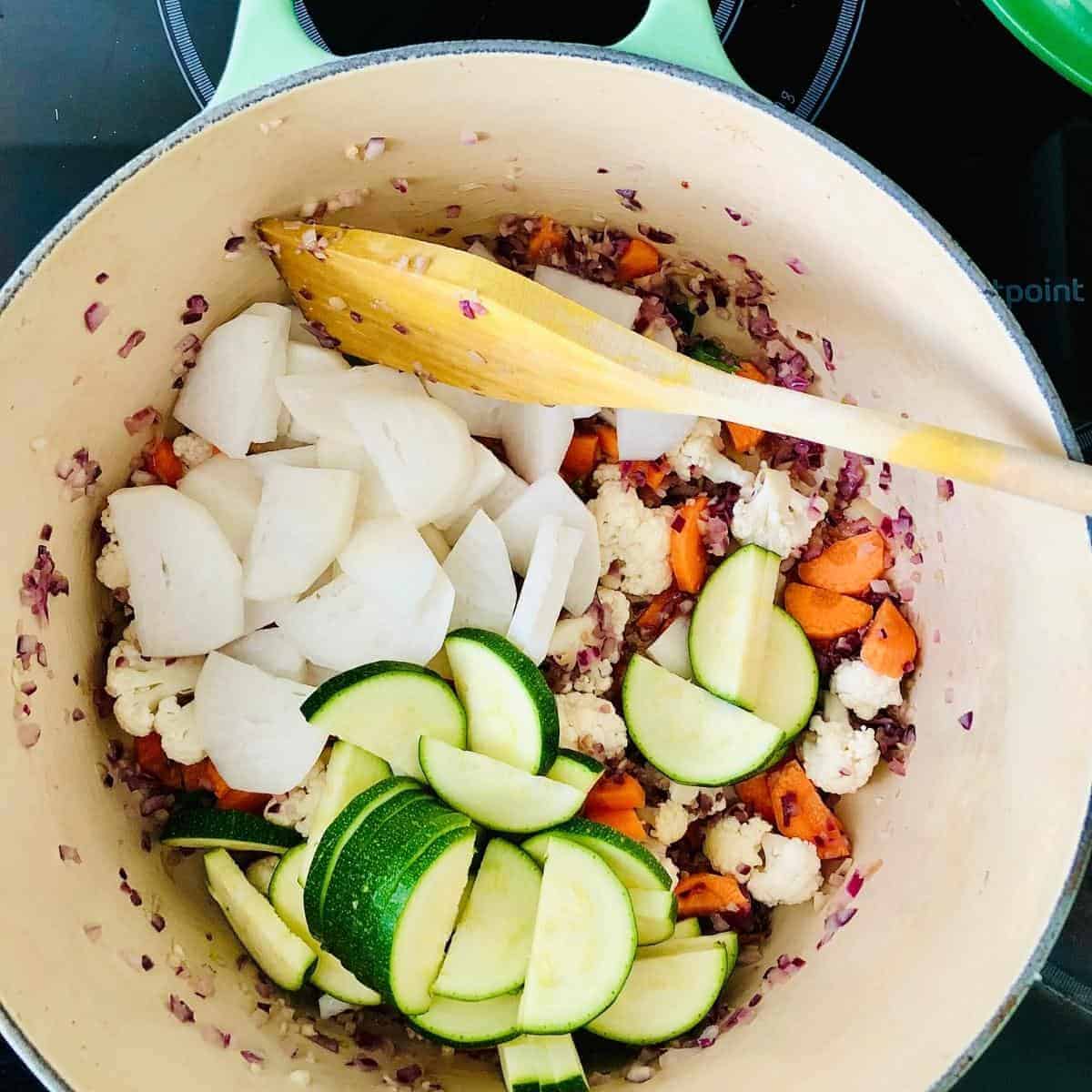 Carrot, cauliflower, courgette and turnip sautéing for ishtew vegetable stew