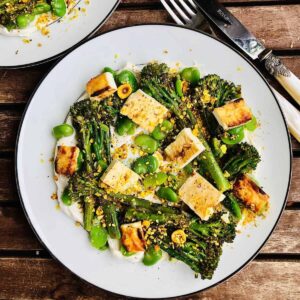 A plate of Labneh with grilled broccoli and baked feta