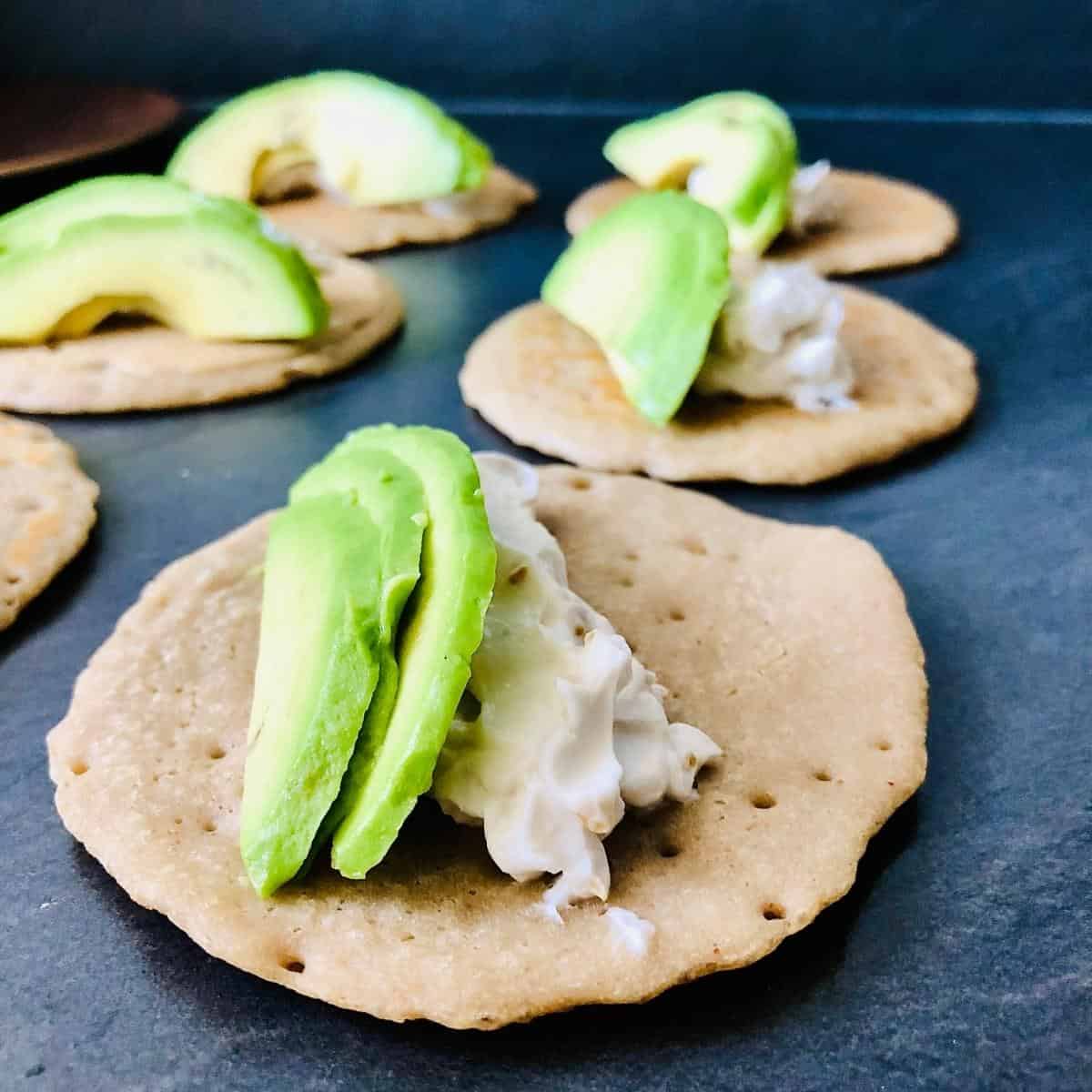 Buckwheat pancake with vegan cream cheese and two slices of avocado