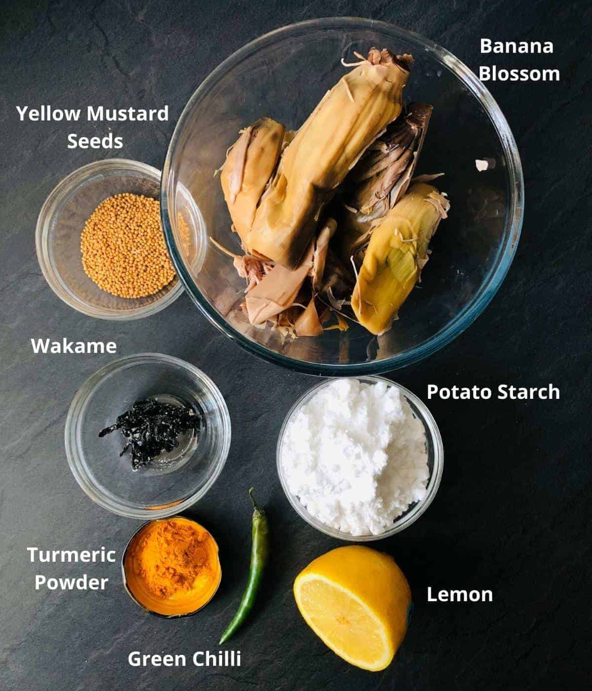 Ingredients for vegan fish in mustard sauce in small glass bowls. Annotated
