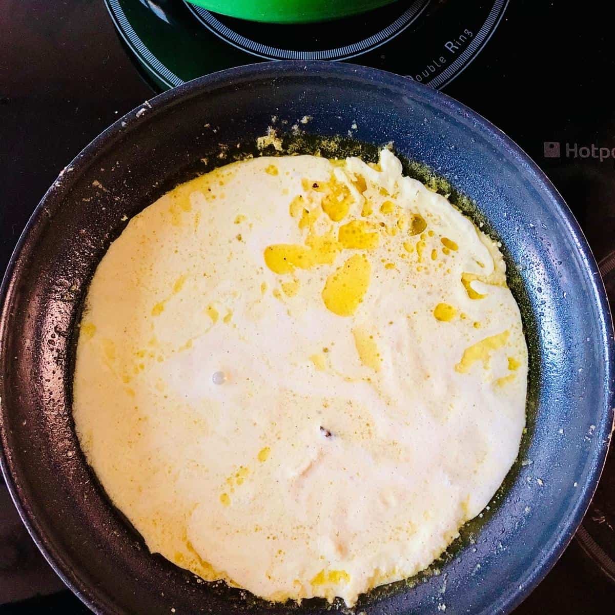 A pan containing mustard sauce mix for vegan fish recipe.