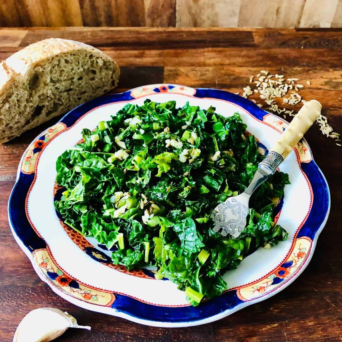 A plate of cavalo nero with a fork