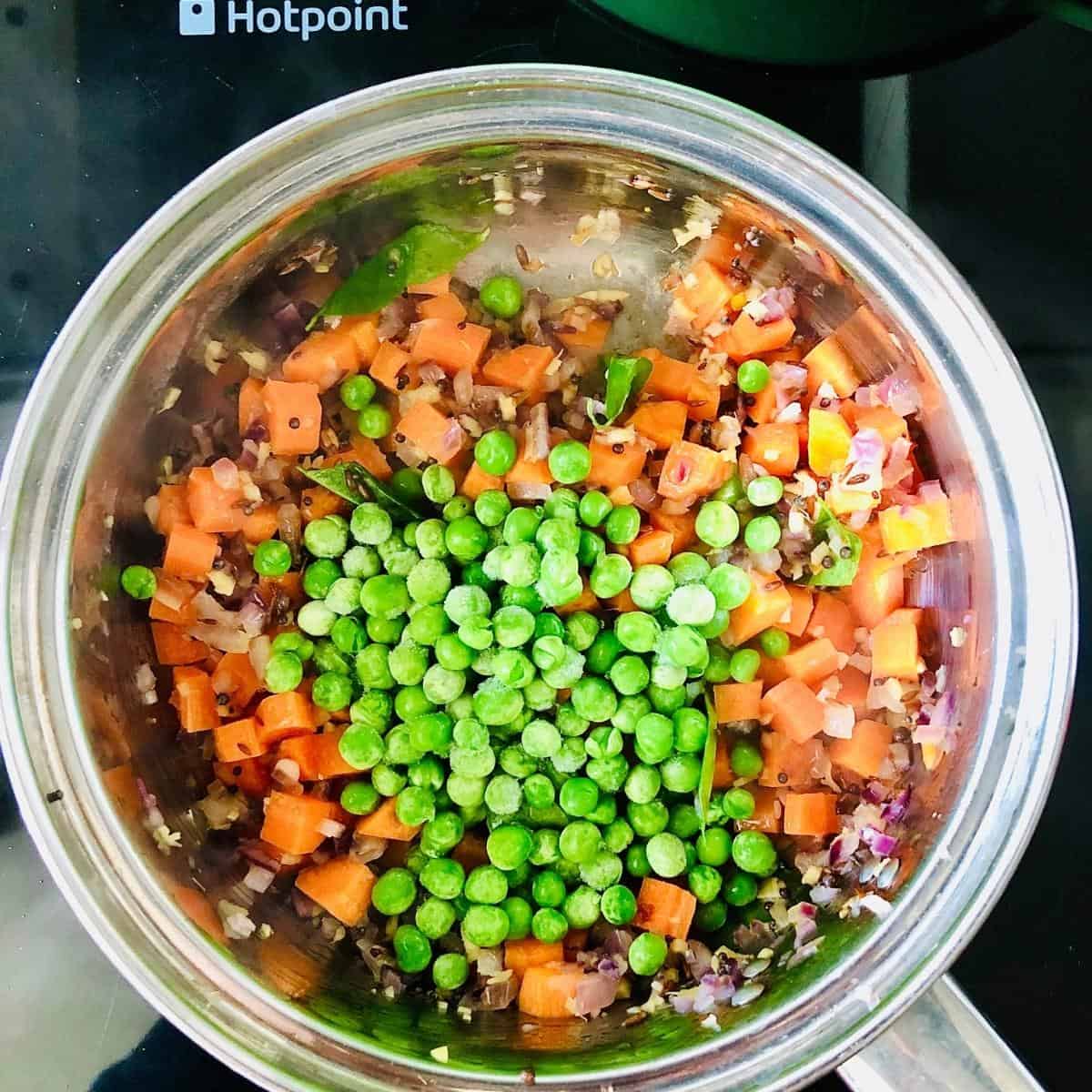 Dalia mix in saucepan, adding the peas for healthy breakfast recipe