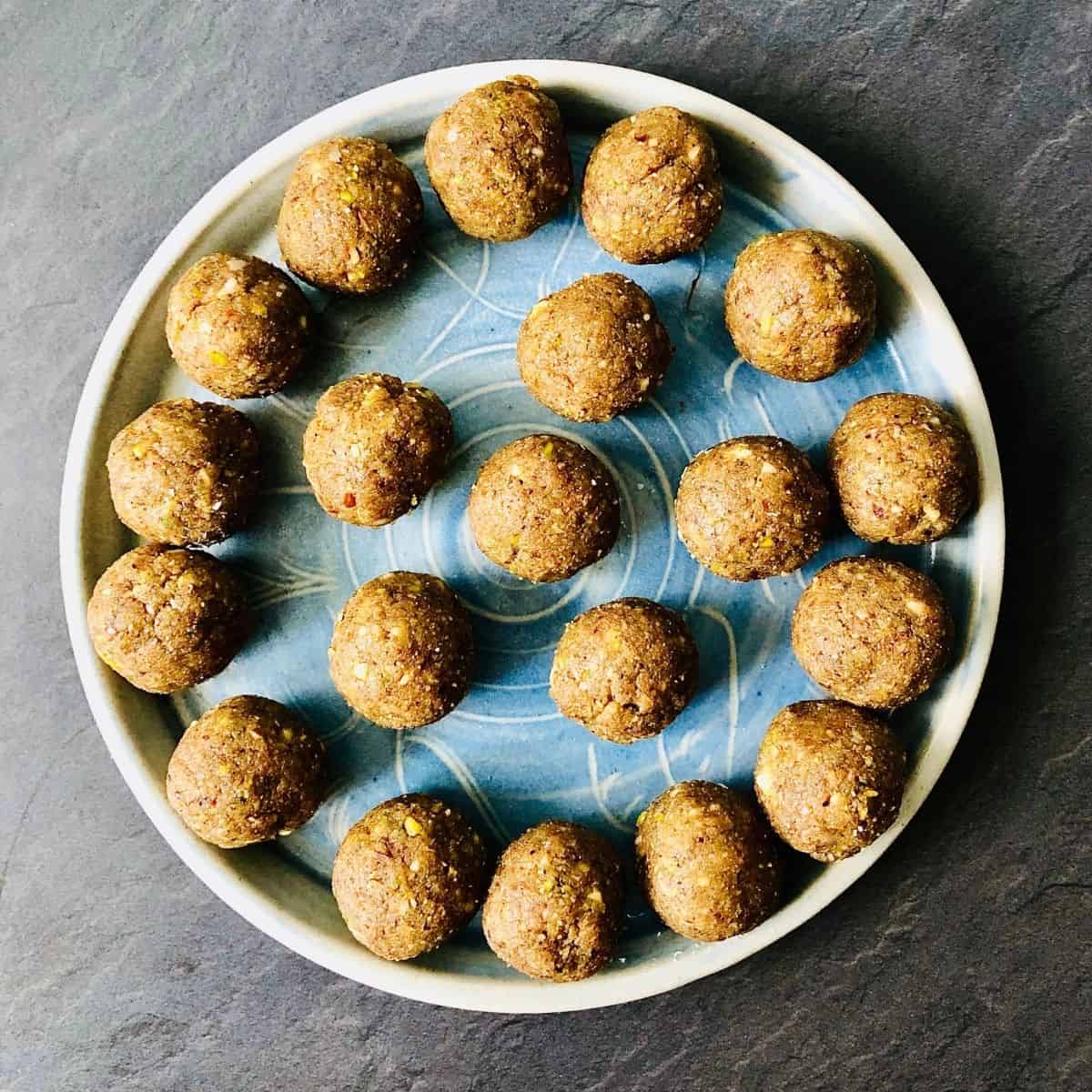 Twenty balls of thundai bliss ball mixture on a plate