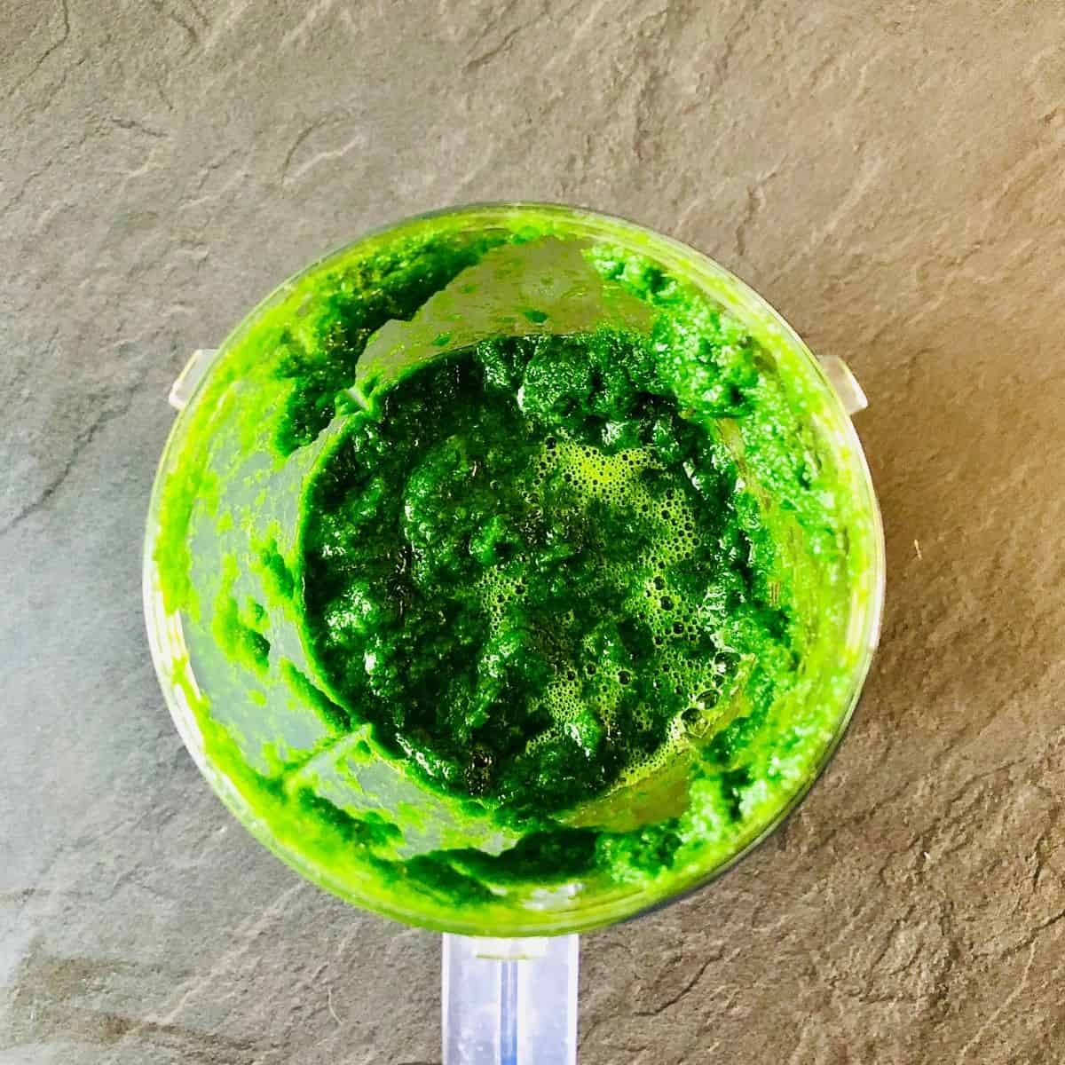 Pureed wild garlic in a blender cup