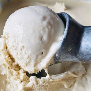 A close up of a scoop of dairy free spiced ice cream.