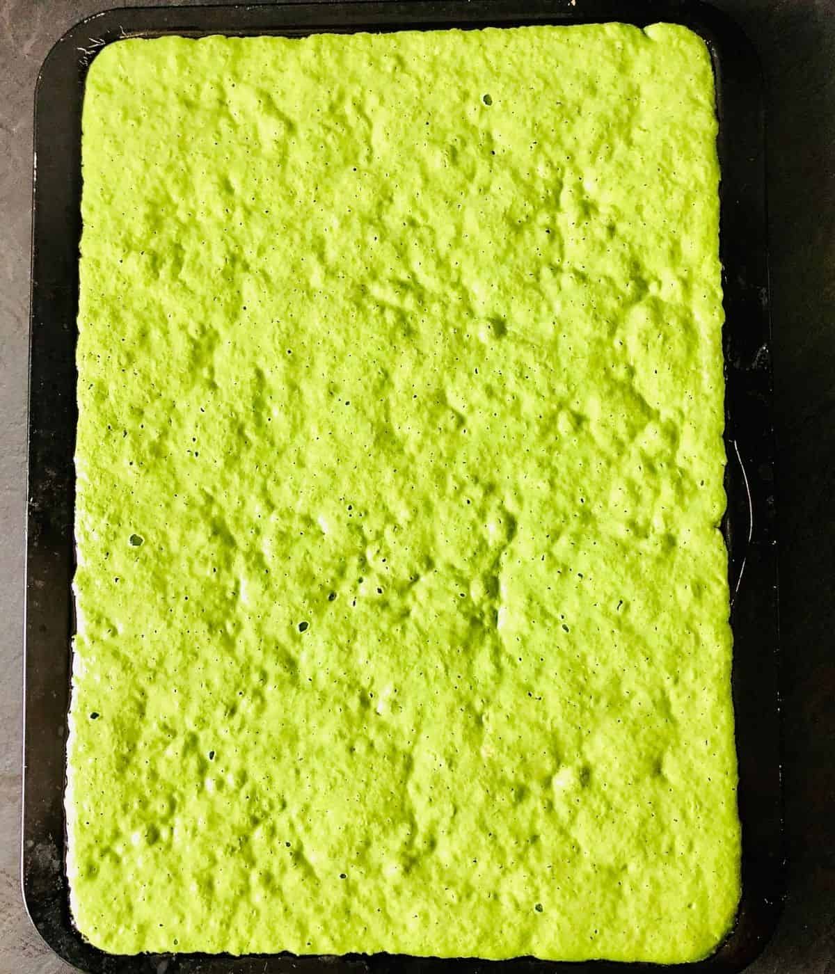 Wild garlic focaccia dough in a baking tray after second proving.