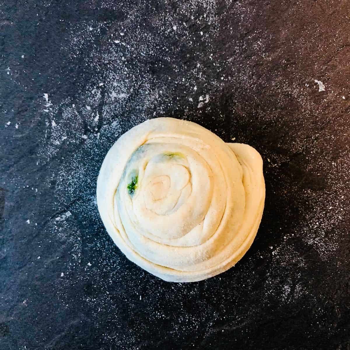 Wild garlic laccha paratha dough rolled into a bun