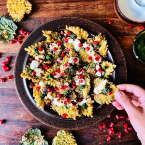 A plate containing Patte Ki Chaat made with nettle leaves.