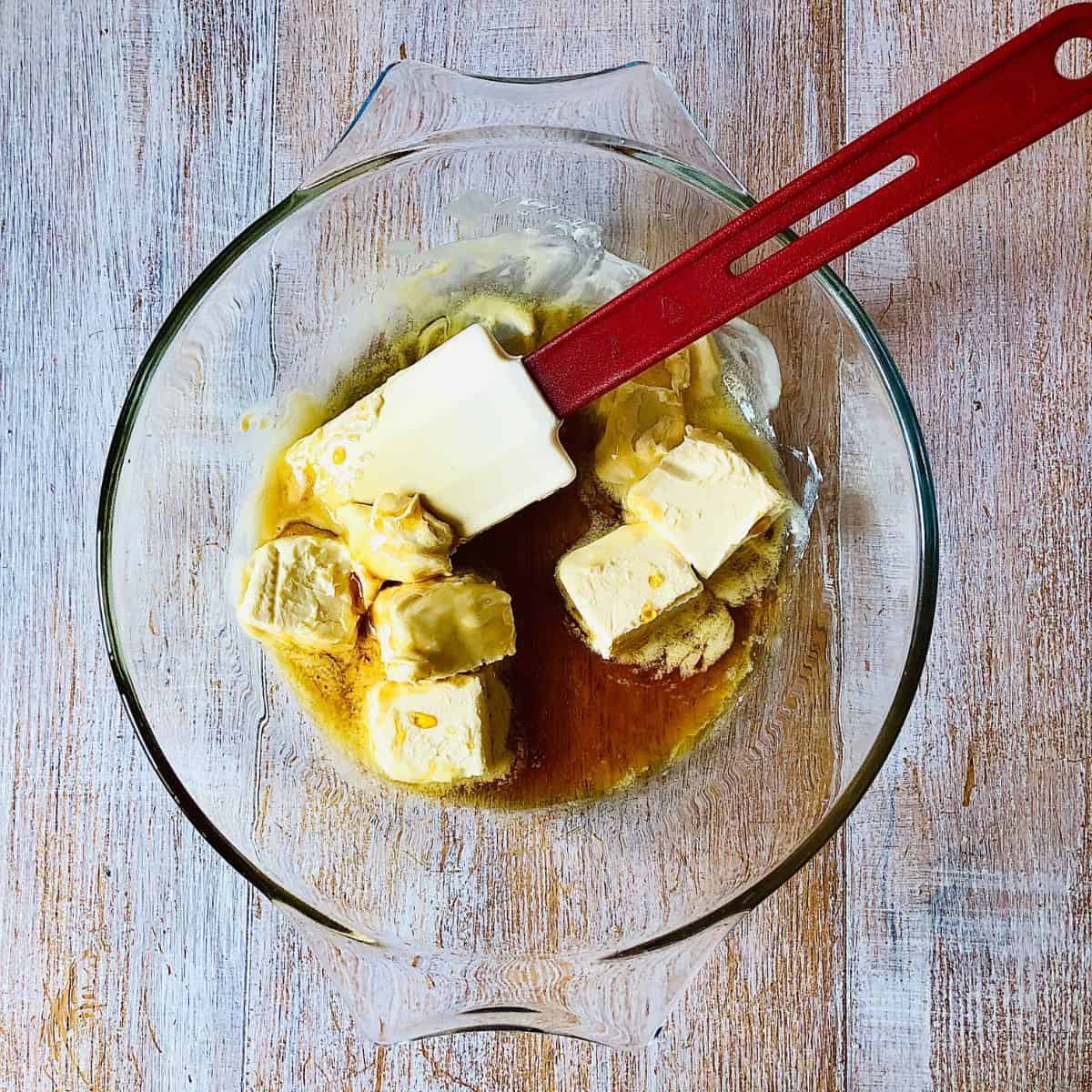 Vegan block butter cubes and golden syrup in a glass bowl ready to mix.