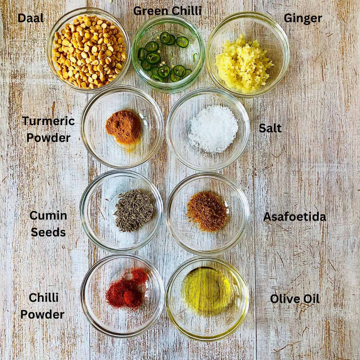 Prepared ingredients for a basic daal recipe in small glass dishes.