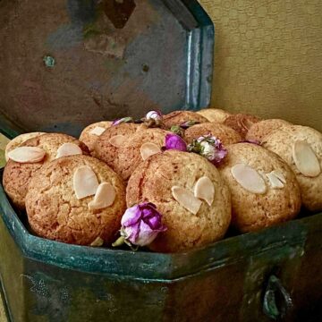 Gulab Jamun cookies packed into a metal box.