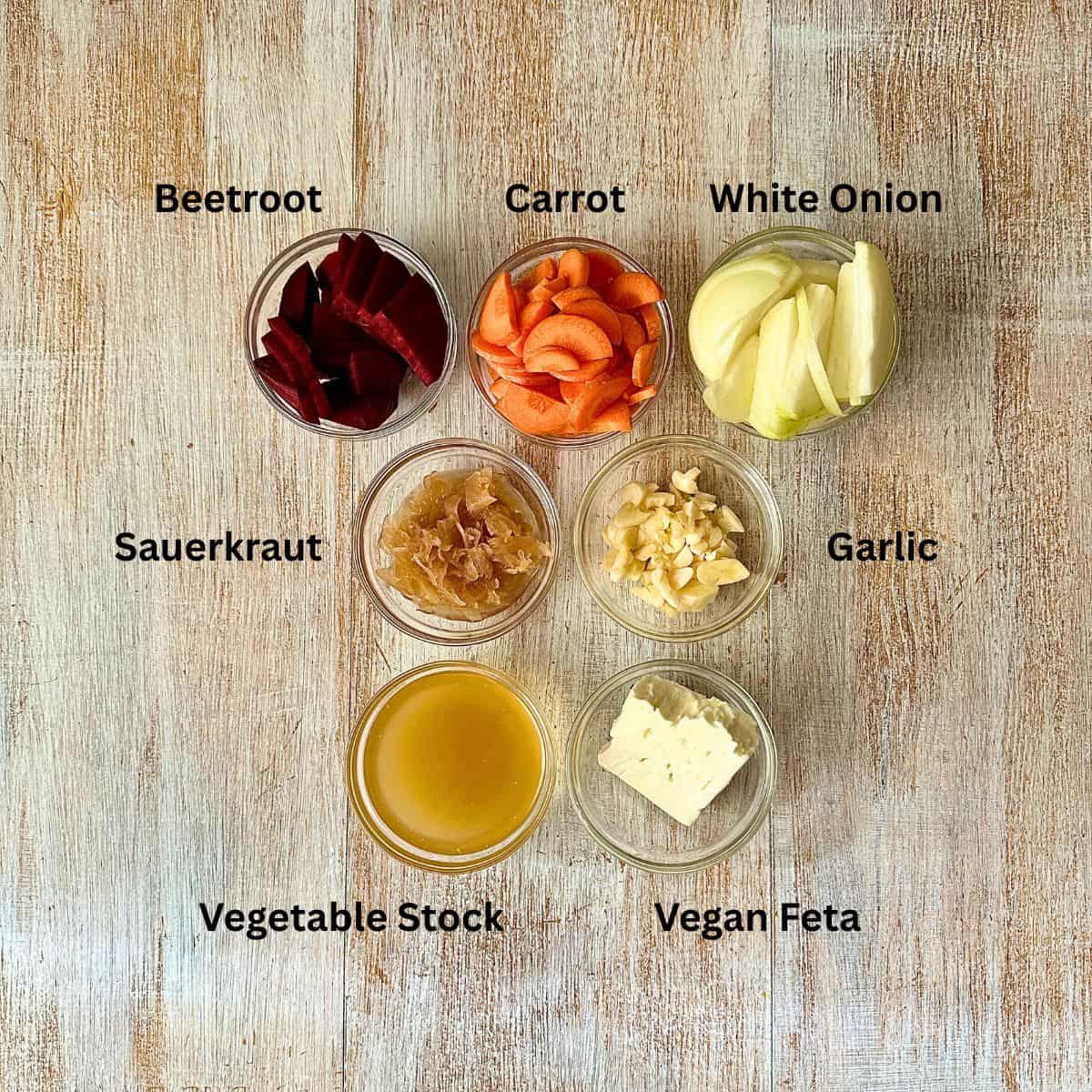 Prepared ingredients for Beetroot soup with sauerkraut in small glass dishes.