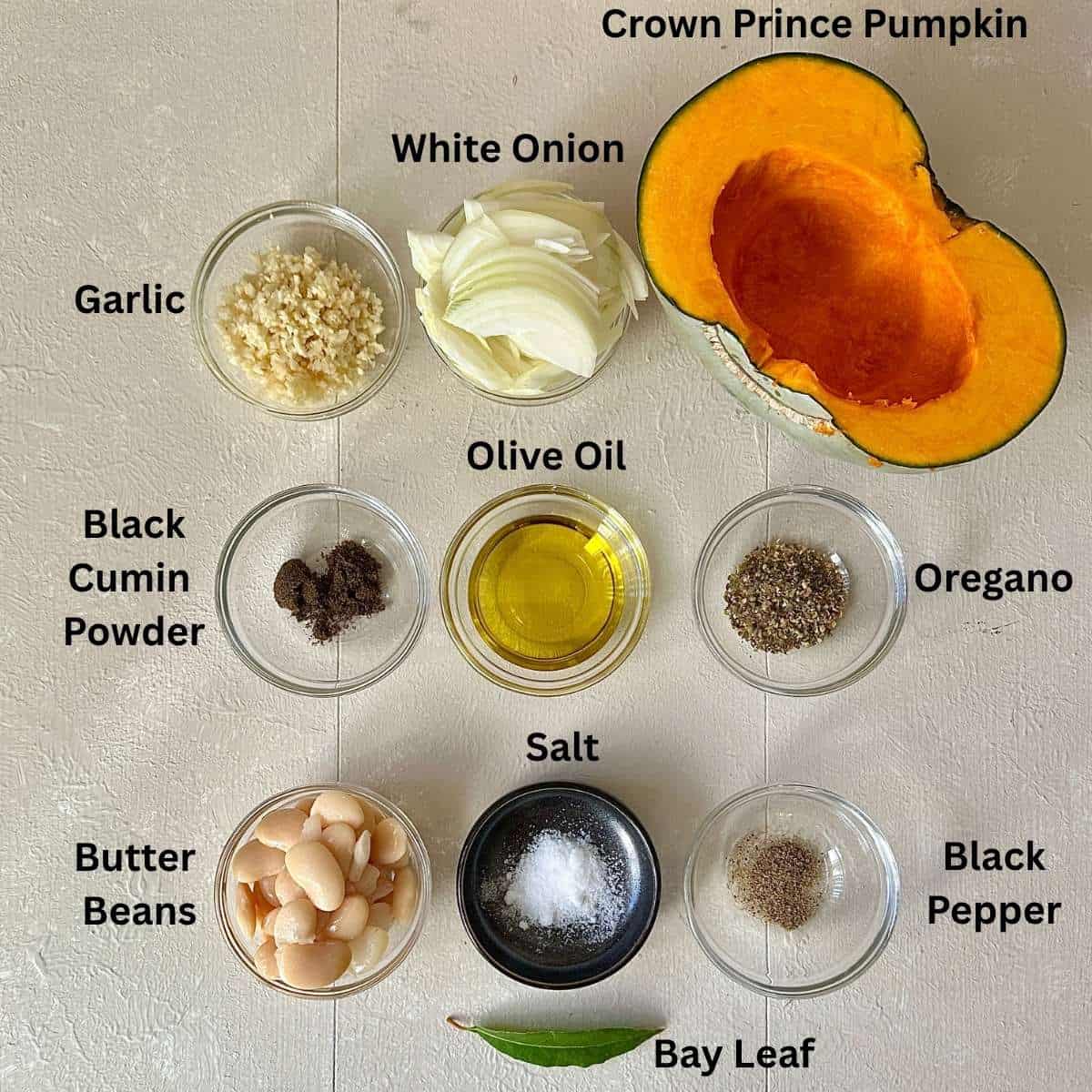 Ingredients for crown prince pumpkin galette in small glass and ceramic dishes.