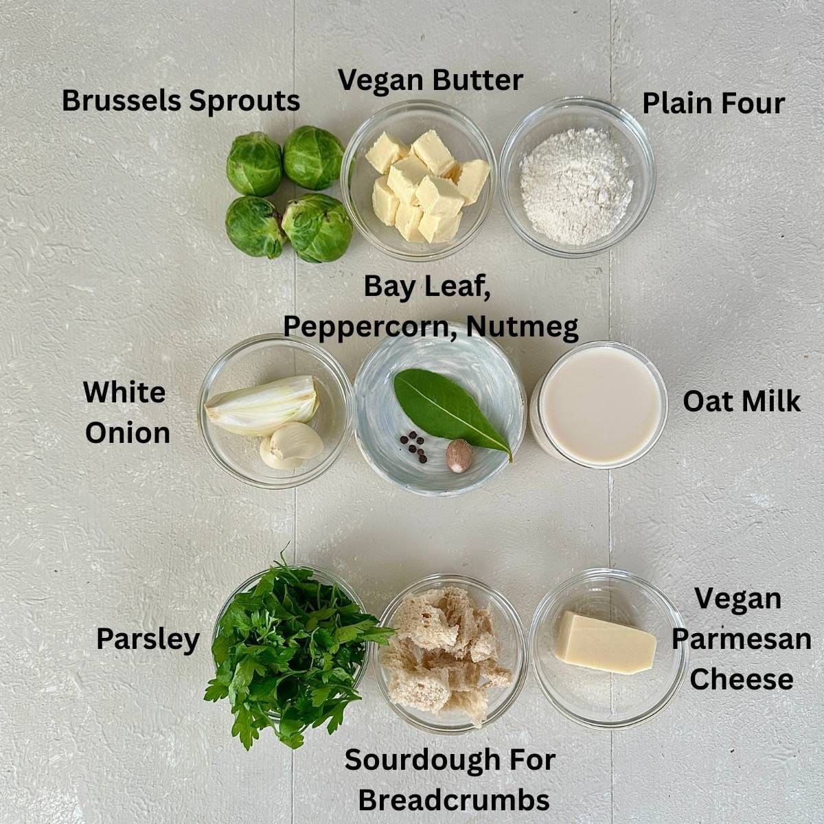 Prepared ingredients for crispy roasted Brussels sprouts in small glass dishes. Annotated.