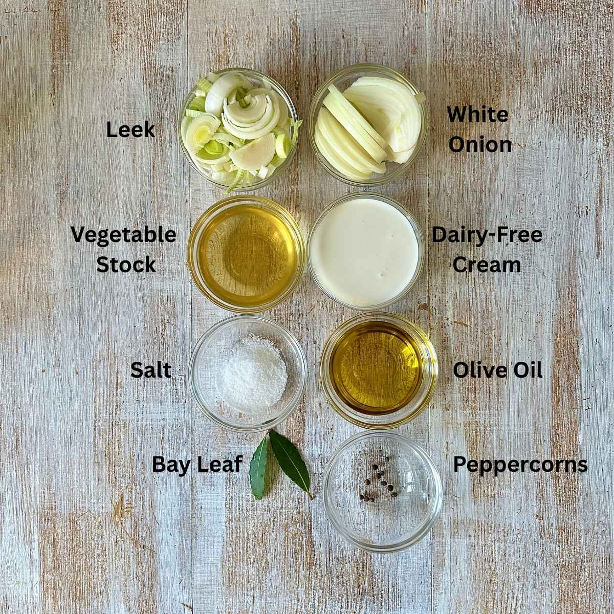 Prepared ingredients for caramelised onion and leek soup in small glass dishes. Annotated.