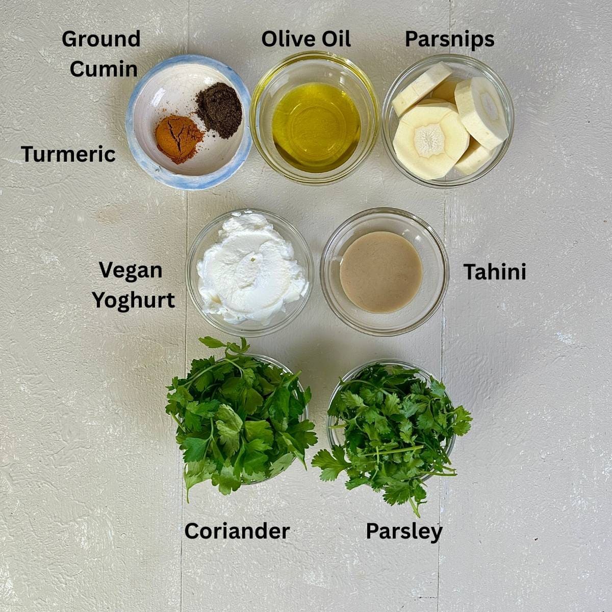 Prepared ingredients for smashed roast parsnips with a yoghurt tahini dip. Annotated.