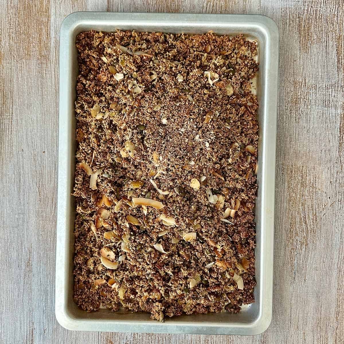A baking tray containing sugar free granola mix after it has been roasted in the oven.
