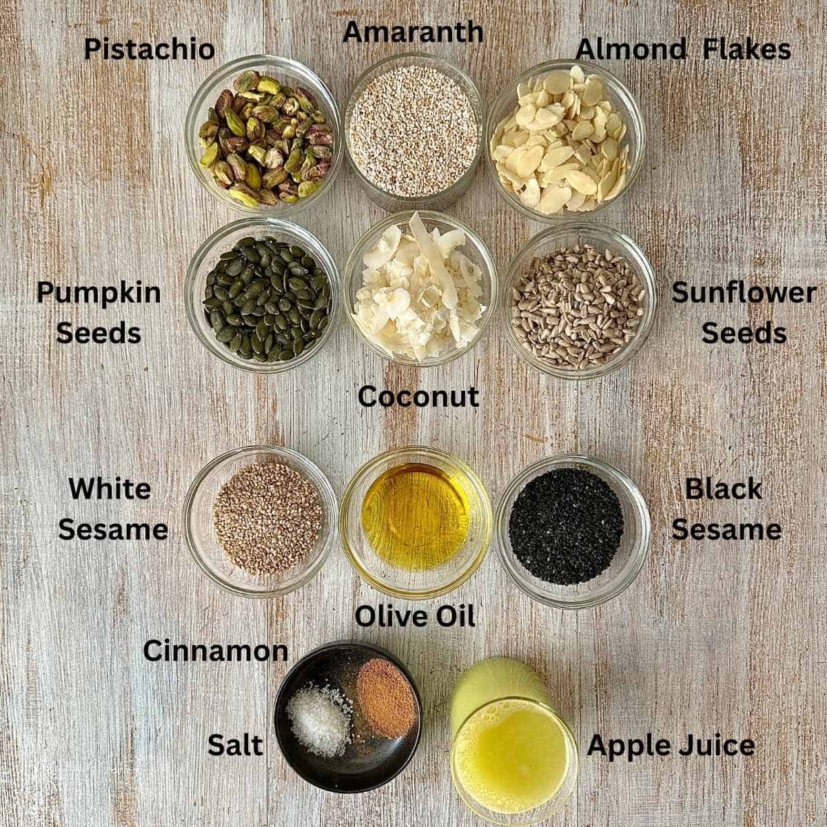 Ingredients for sugar free granola in small glass dishes. The ingredients are annotated.