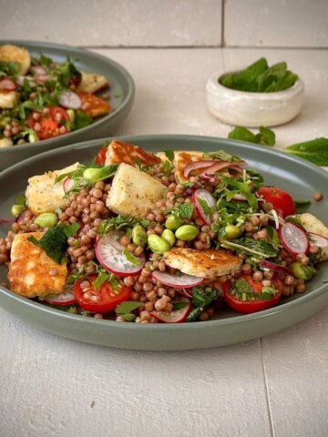 Couscous salad with zaatar halloumi, herbs, radishes and cherry tomatoes.