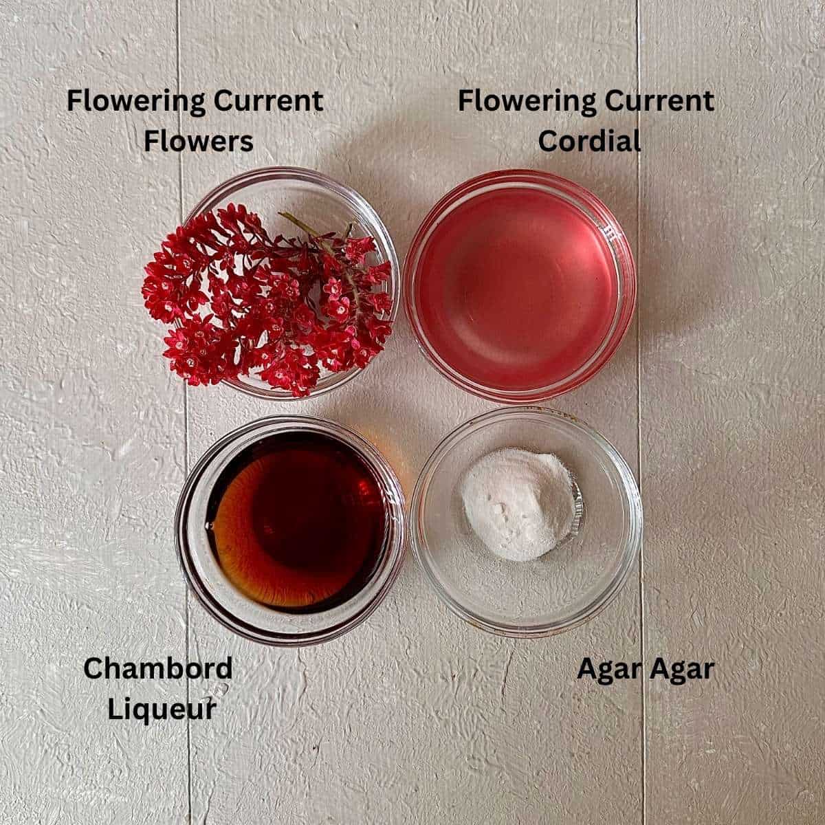 Ingredients for flowering current jelly dessert in small glass dishes. The ingredients are annotated.
