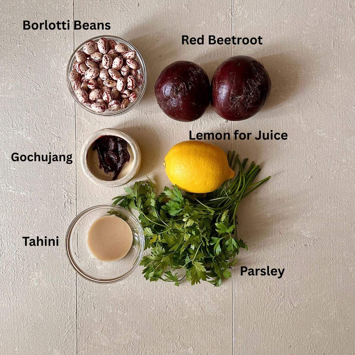 Ingredients for beetroot skewers laid out against a white background. The ingredients are annotated.