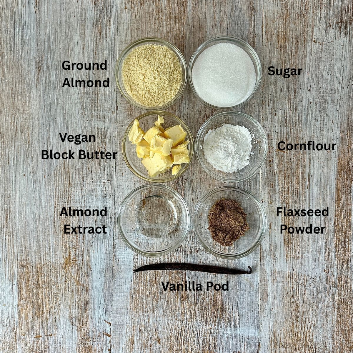 Ingredients for the frangipane for a vegan poached quince frangipane tart. The ingredients are annotated.